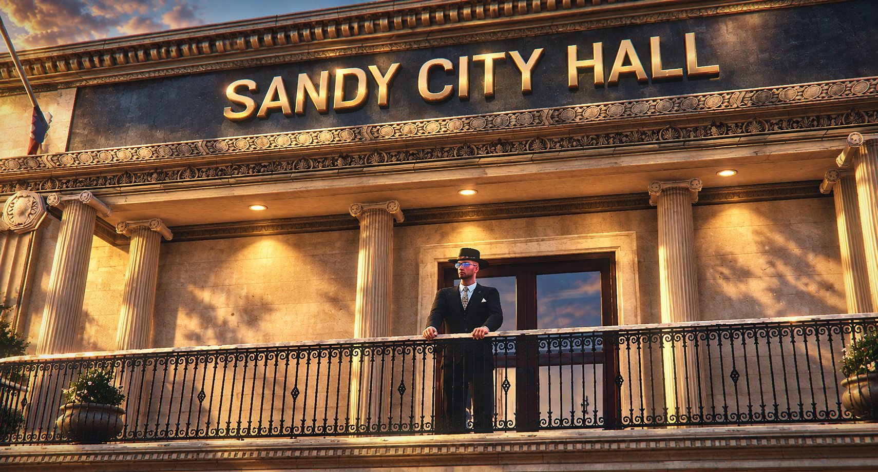 Facciata del municipio di Sandy Shores al tramonto, con un uomo in completo sul balcone